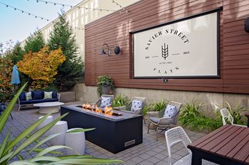 Outdoor courtyard lounge with projection screen
